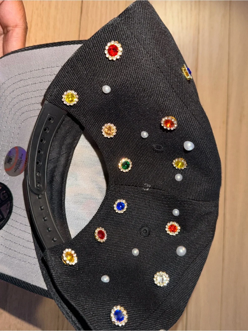 Embellished Black Baseball Cap with Gold Embroidered Rose Accent